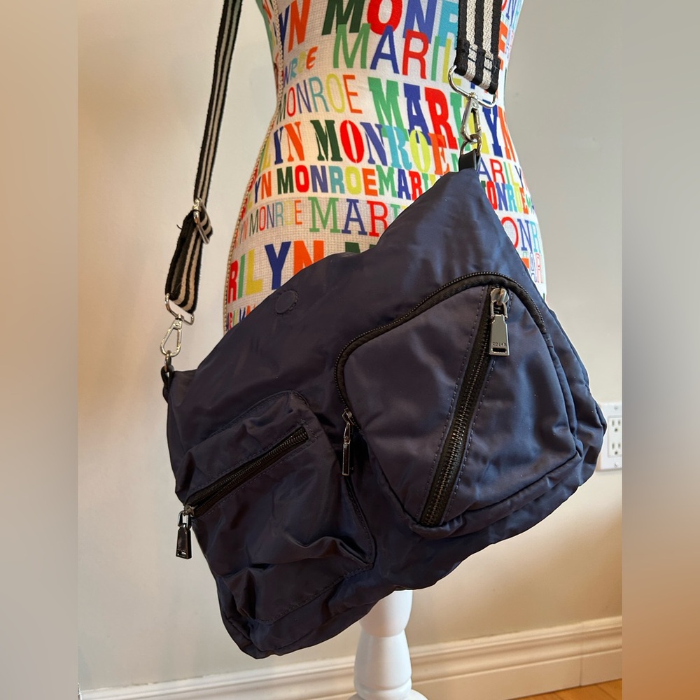 Navy Crossbody Bag with multiple pockets and zipper closure by Colab